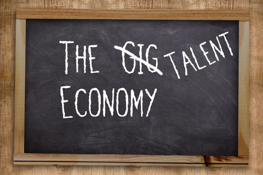 Blackboard with the words the talent economy on it.