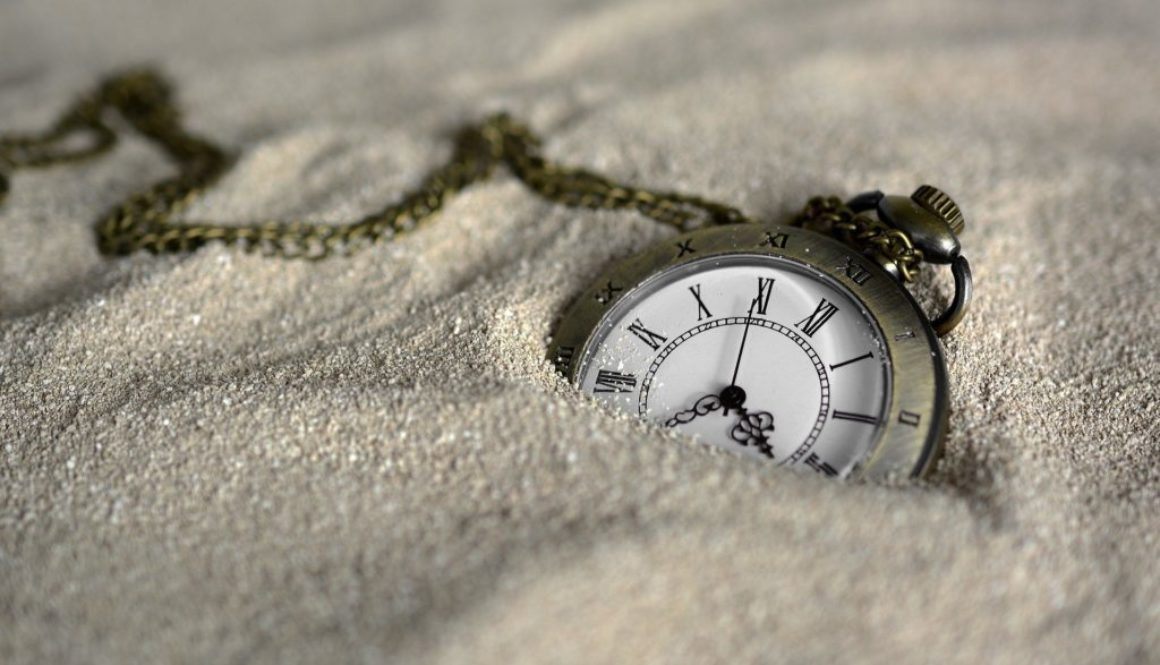 Trust owned life insurance liabilities. Pic of a pocketwatch buried in the sand