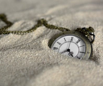 Trust owned life insurance liabilities. Pic of a pocketwatch buried in the sand